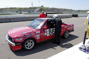 Missing Link Motorsports BMW 325i in the pits during a driver's change.