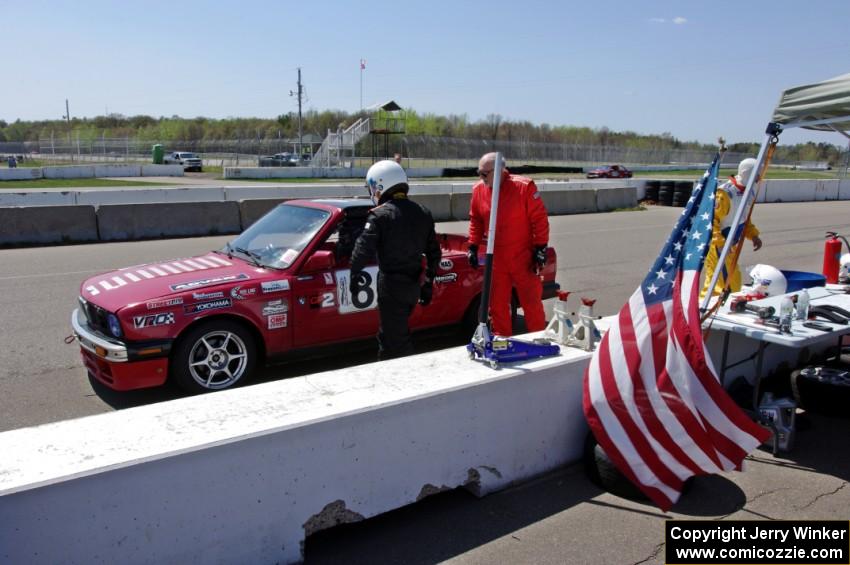 Missing Link Motorsports BMW 325i in the pits during a driver's change.