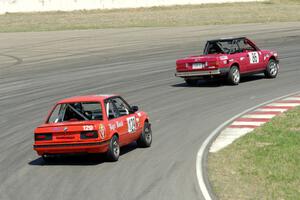Missing Link Motorsports BMW 325i followed by E30 Bombers BMW 325i