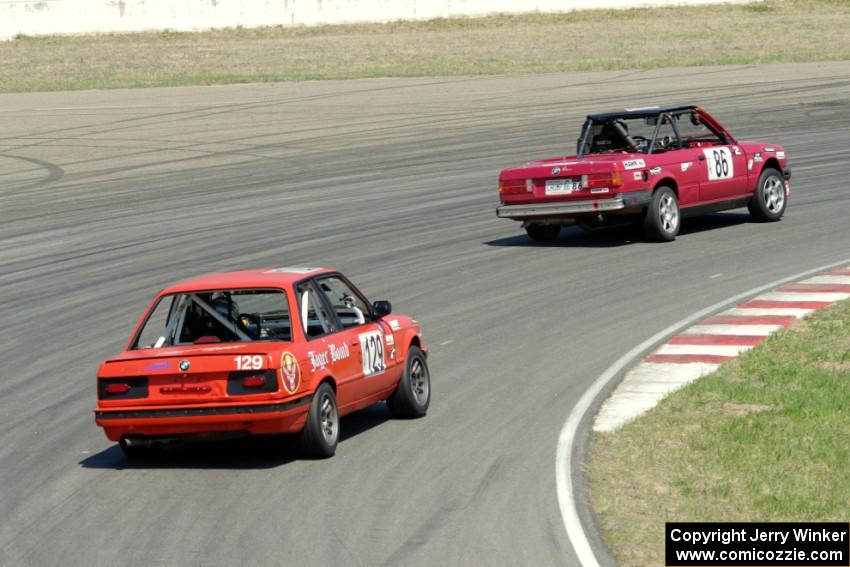 Missing Link Motorsports BMW 325i followed by E30 Bombers BMW 325i