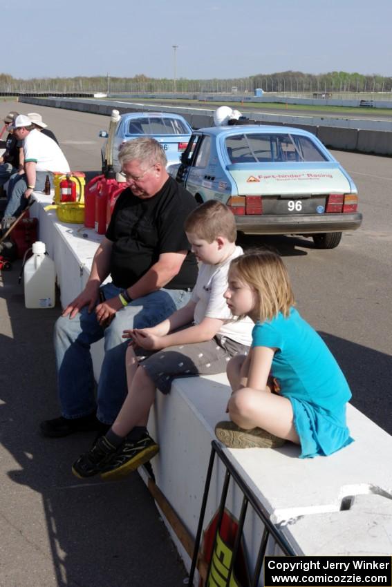 Tim Winker with his nephew and niece on the pit wall.