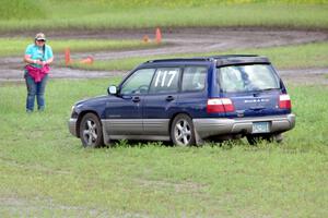 Matt Walters' MA Subaru Forester WRX slides off into the wet grass.