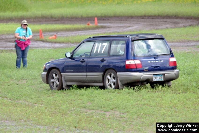 Matt Walters' MA Subaru Forester WRX slides off into the wet grass.