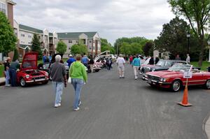 British cars on the left and Mercedes-Benzes on the right.