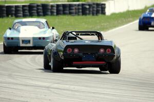 Doug Rippie's Chevy Corvette chases Daryn Bosell's Chevy Corvette