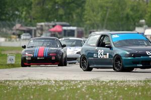 Mark Utecht's ITJ Honda Civic with Samantha Silver's and Chris Craft's Spec Miata Mazda Miatas