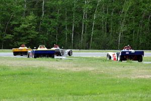 Scott Goolsbey's and Matt Gray's Spec Racer Ford 3s with Reid Johnson's and Bill Collins' Spec Racer Fords at turn five