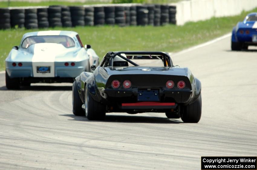 Doug Rippie's Chevy Corvette chases Daryn Bosell's Chevy Corvette