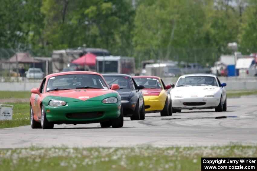 Erik Nelson's, Paul Gilbert's, Greg Youngdahl's and Nick Lougee's Spec Miata Mazda Miatas