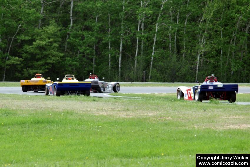 Scott Goolsbey's and Matt Gray's Spec Racer Ford 3s with Reid Johnson's and Bill Collins' Spec Racer Fords at turn five