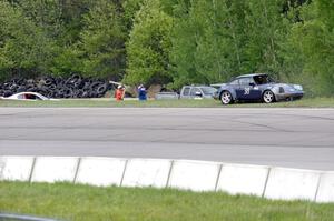Tom Fuehrer's SPO Ford Mustang and Craig Stephens' ITE-1 Porsche 911 at the topside of turn 1.