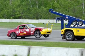 Greg Youngdahl's ITA Mazda Miata comes in on the hook.