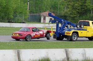 Greg Youngdahl's ITA Mazda Miata comes in on the hook.