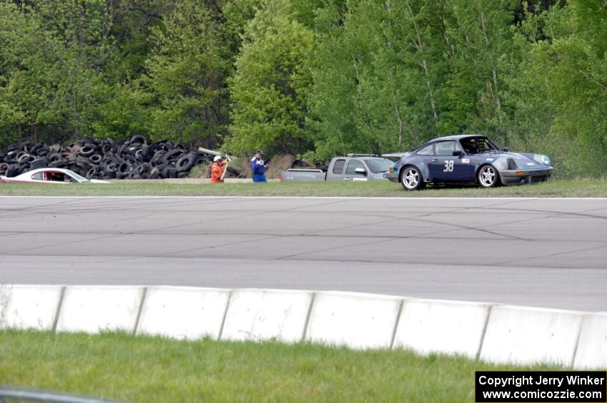 Tom Fuehrer's SPO Ford Mustang and Craig Stephens' ITE-1 Porsche 911 at the topside of turn 1.