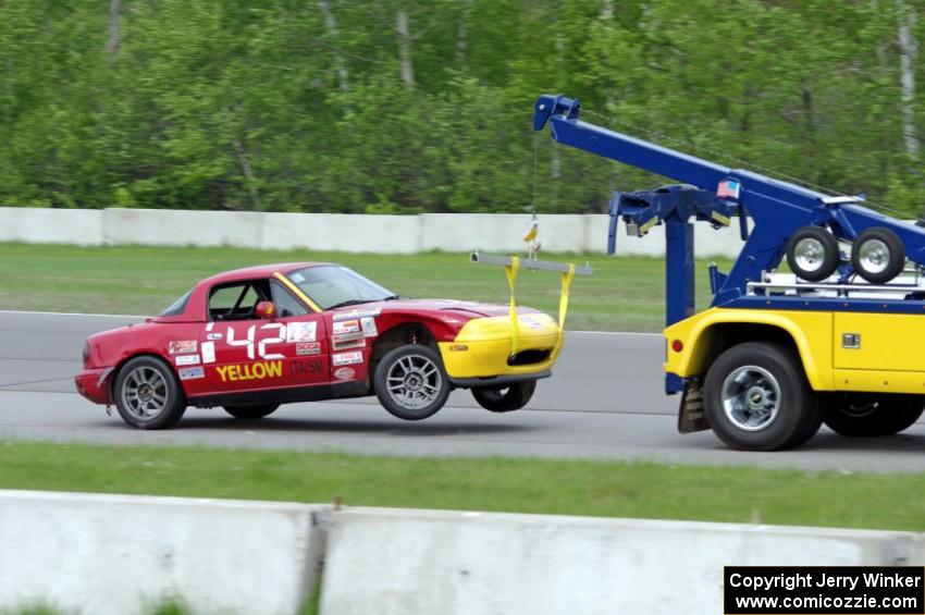 Greg Youngdahl's ITA Mazda Miata comes in on the hook.