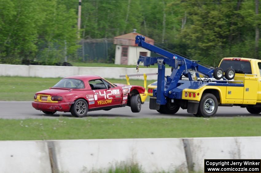 Greg Youngdahl's ITA Mazda Miata comes in on the hook.