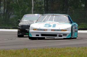 Guy Dirkin's SU Olds Cutlass Supreme and Jeff Demetri's American Iron Ford Mustang