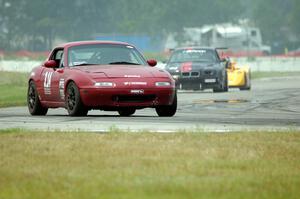 Nick Scott's PTE Mazda Miata, Kerry James' GTS2 BMW M3 and Matt Gray's PTB Spec Racer Ford