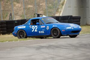 Paul Pridday's Spec Miata Mazda Miata spins coming out of turn 12.