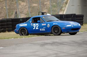 Paul Pridday's Spec Miata Mazda Miata spins coming out of turn 12.