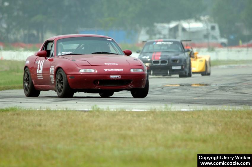 Nick Scott's PTE Mazda Miata, Kerry James' GTS2 BMW M3 and Matt Gray's PTB Spec Racer Ford