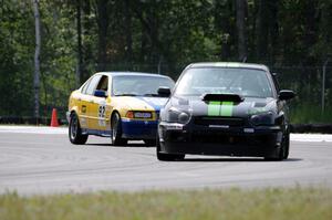 Team STI Guys' ST3 Subaru WRX STi and Andy Orr's GTS2 BMW 325i