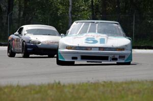 Guy Dirkin's SU Olds Cutlass Supreme and Tom Roberts' PTE Mazda Miata