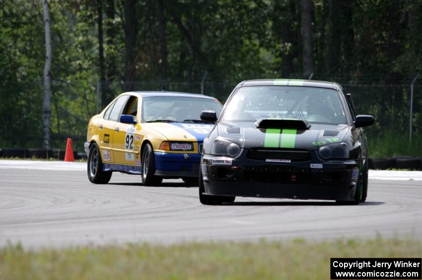 Team STI Guys' ST3 Subaru WRX STi and Andy Orr's GTS2 BMW 325i