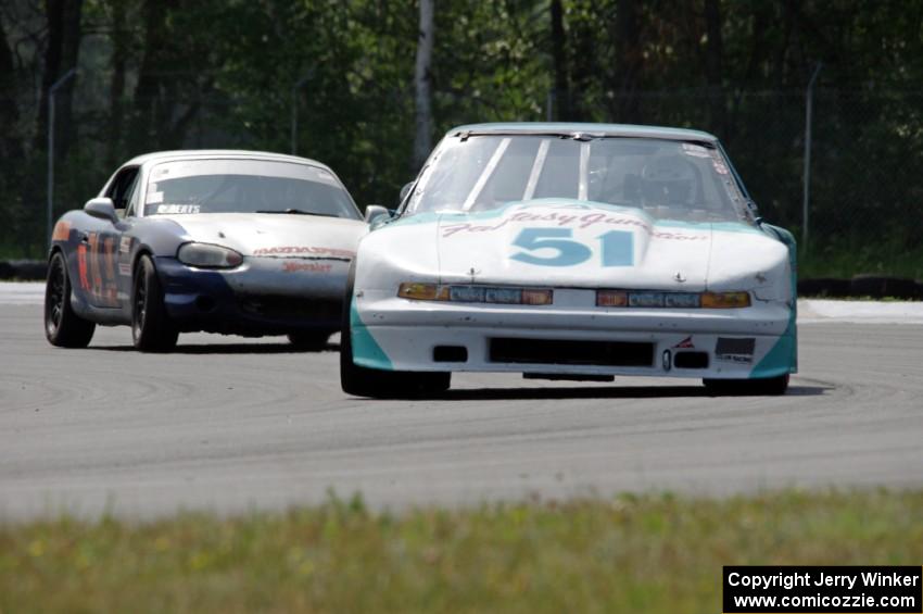 Guy Dirkin's SU Olds Cutlass Supreme and Tom Roberts' PTE Mazda Miata