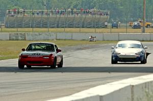 Team Cohn's PTE Mazda Miata and Tom Roberts' PTE Mazda Miata