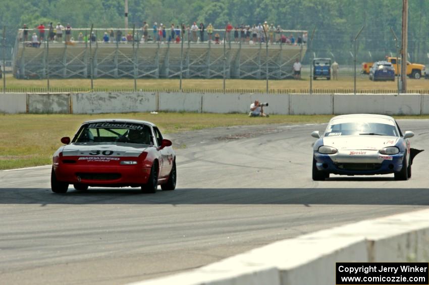 Team Cohn's PTE Mazda Miata and Tom Roberts' PTE Mazda Miata