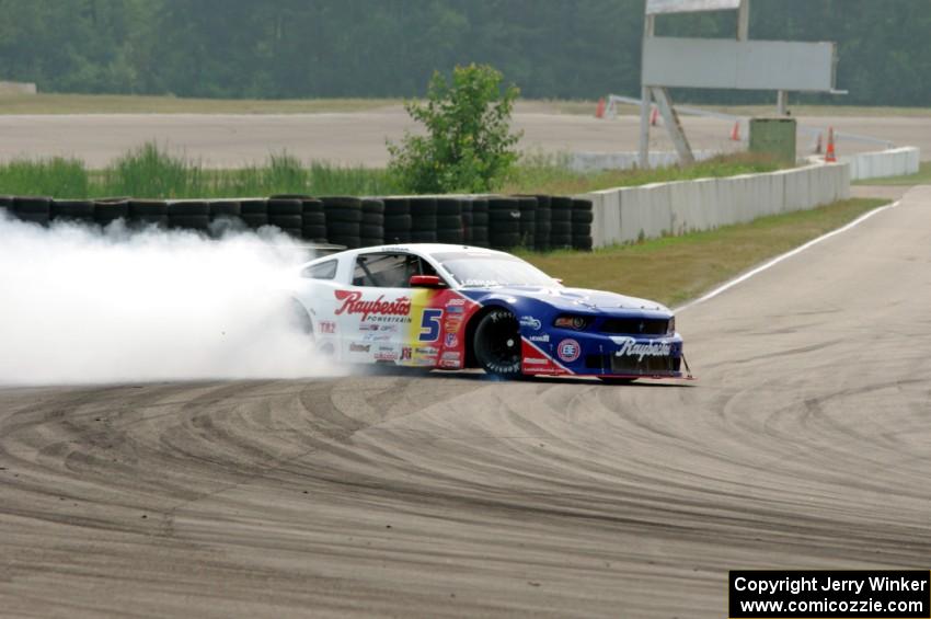 Lawrence Loshak's Ford Mustang spins coming out of turn 13.