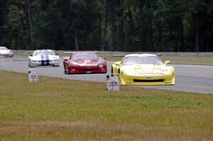 Doug Peterson's Chevy Corvette leads Amy Ruman's Chevy Corvette and Cliff Ebben's Ford Mustang