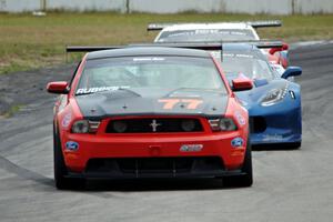 Tim Rubright's Ford Mustang, Mickey Wright's Chevy Corvette and Simon Gregg's Chevy Corvette