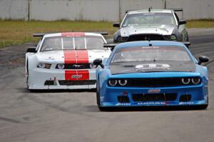 Cameron Lawrence's Dodge Challenger, Tony Ave's Ford Mustang and