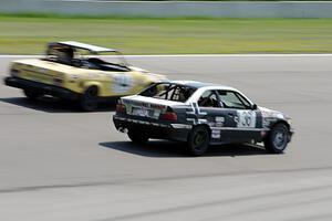 Ambitious But Rubbish Racing BMW 325 passes Rat Patrol Triumph TR-7