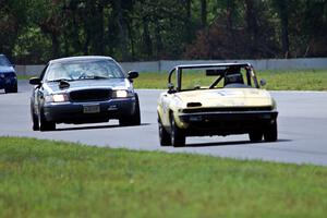 Rat Patrol Triumph TR-7 and Moss Racing Ford Crown Victoria