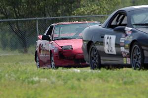 Teufel Hunden Toyota MR-2 chases ProKart Racing Chevy Camaro