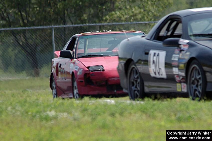 Teufel Hunden Toyota MR-2 chases ProKart Racing Chevy Camaro