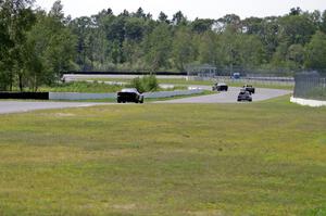 ProKart Racing Chevy Camaro chases three BMWs into turns 7 and 8.