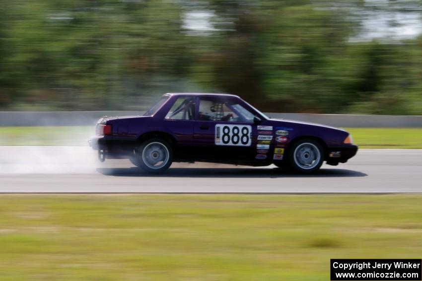 Purple-Headed Chumps Ford Mustang loses its engine at turn 3.