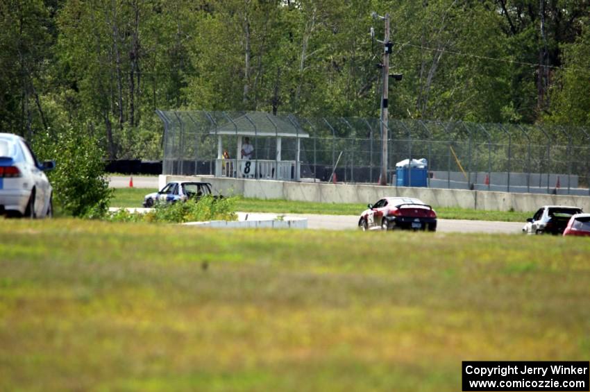 Several cars head into turns 7 and 8.