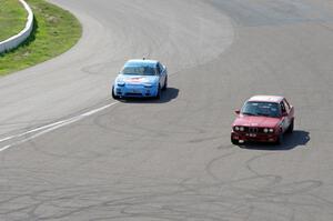 Team McQueen Nissan 240SX and Probs Racing BMW 325is