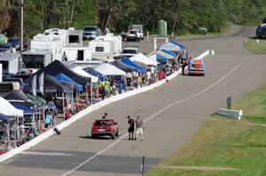 Bromance Racing Ford Mustang and Cheap Shot Racing BMW 325is in the pits.