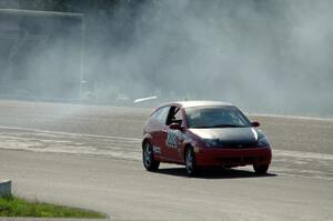 Three Sheets Racing Ford Focus ZX3 recovers after having a spin headed into turn 10.