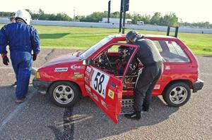 Team Festivus Ford Festiva in the pits.