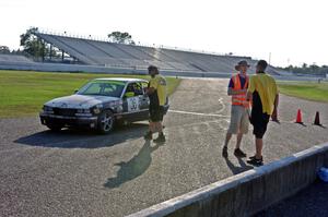 Ambitious But Rubbish Racing BMW 325 in the pits.