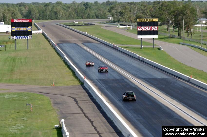 Team Jagermoose Porsche 914, and Mayhem Racing Honda Civic on the front straight.