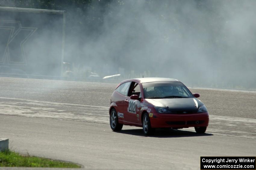 Three Sheets Racing Ford Focus ZX3 recovers after having a spin headed into turn 10.