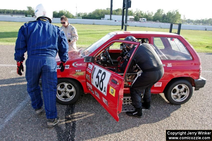 Team Festivus Ford Festiva in the pits.